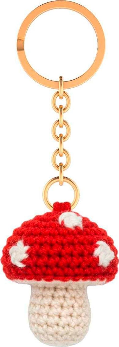 Häkeln Pilz-Schlüsselanhänger mit rotem Hut und weißen Punkten. Goldene Kette und Ring.