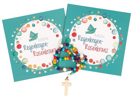 Text: „Mein Regenbogen-Rosenkranz“. Zwei Hefte mit bunten Kreisen und Vogelbild, farbiger Rosenkranz mit Holzkreuz.