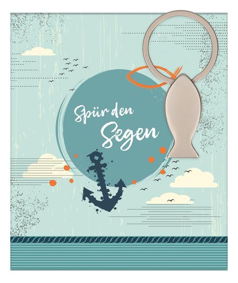 "Spür den Segen" steht in einem Kreis. Darunter ist ein Anker, diagonal ein Fisch-Schlüsselanhänger.