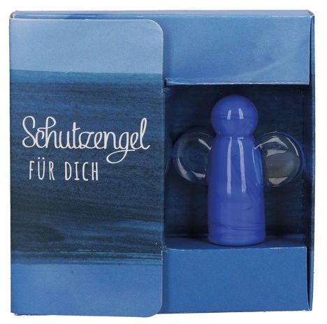 Text: „Schutzengel für dich“. Eine blaue Figur mit Flügeln in einer Verpackung.