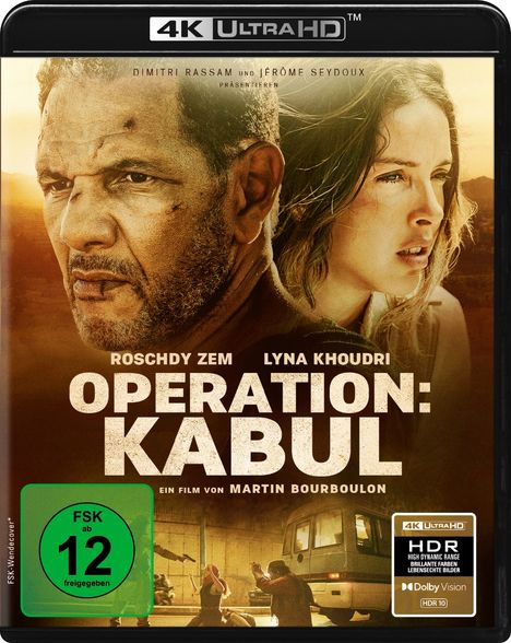 „OPERATION: KABUL“ mit Roschdy Zem, Lyna Khoudri. FSK ab 12. Zwei ernst dreinschauende Personen vor dramatischem Hintergrund.