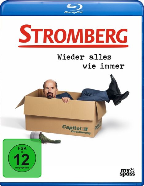 "Stromberg: Wieder alles wie immer" steht über einem Mann in einem Karton. "Capitol Versicherung" ist am Karton aufgedruckt.