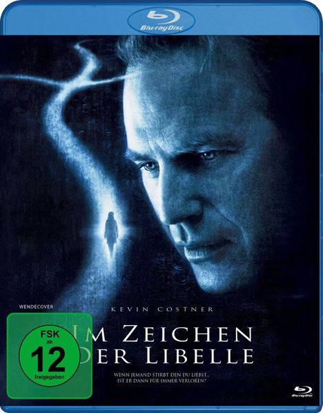 Titel "Im Zeichen der Libelle", Darsteller "Kevin Costner", FSK 12, ein Gesicht und eine Silhouette auf dunklem Hintergrund.