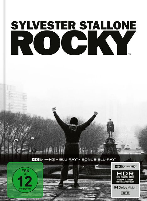 Text: "SYLVESTER STALLONE ROCKY", "FSK ab 12 freigegeben", "4K Ultra HD". Szene: Person hebt triumphierend die Arme auf einer Treppe.
