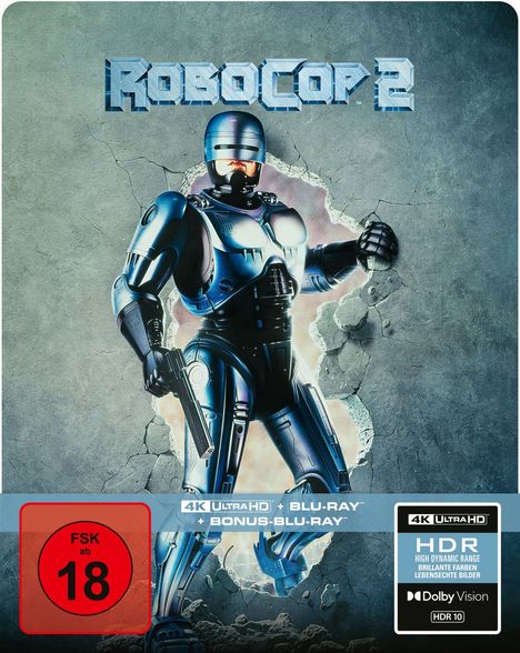 ROBOCOP 2, FSK ab 18, 4K ULTRA HD, HDR, Dolby Vision. Ein Roboter mit Waffe tritt durch eine zerbrochene Wand.

