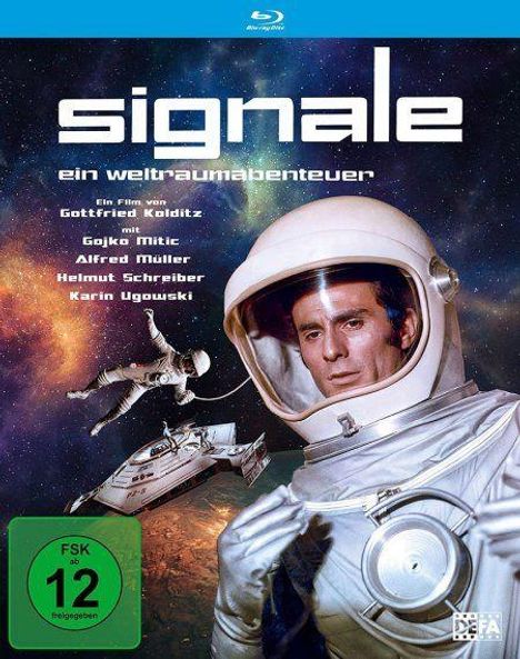 „Signale – ein Weltraumabenteuer“ mit Gojko Mitic. Ein Astronaut im Raumanzug, Raumschiffe im Hintergrund, FSK 12.
