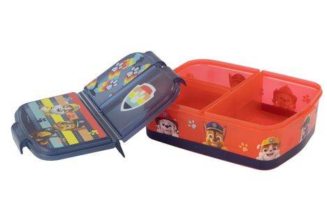 Bunte Brotdose mit Paw Patrol-Illustrationen, mehreren Fächern und Pfotenabdruck- und Schildmotiven auf dem Deckel.