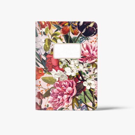 Ein Notizbuch mit floralen Mustern, enthält ein leeres weißes Feld auf der Vorderseite für Beschriftungen.