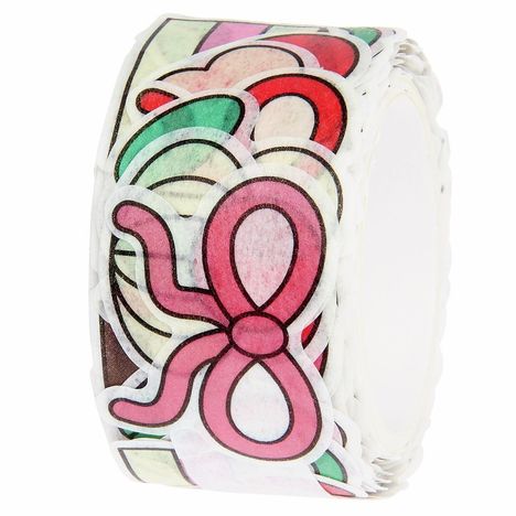 Bunte, gestapelte Aufkleber in Form einer rosa Schleife auf einer Rolle.