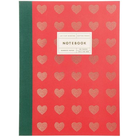 „NOTEBOOK“, roter Hintergrund mit goldenen Herzmustern, grüner Buchrücken.