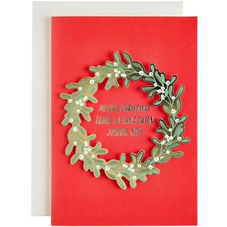 "MERRY CHRISTMAS FROHE WEIHNACHTEN JOYEUX NOËL" in einem Kranz aus grünen Blättern auf rotem Hintergrund.