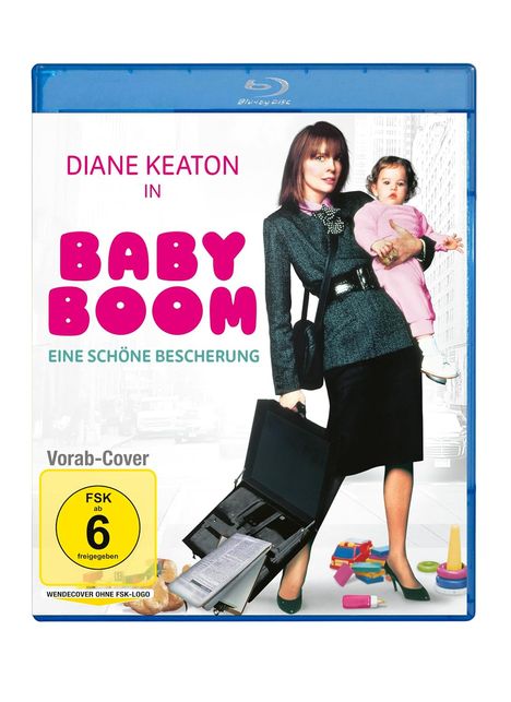 Text oben: "DIANE KEATON IN BABY BOOM". Darunter: "EINE SCHÖNE BESCHERUNG". Frau mit Kind, Umhängetasche und offenem Aktenkoffer.