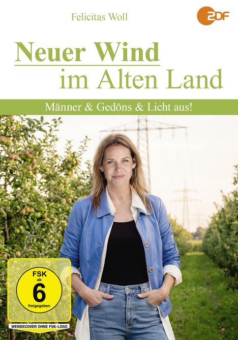 Felicitas Woll, ZDF-Logo, "Neuer Wind im Alten Land", FSK 6, Frau in blauem Mantel, ländlicher Hintergrund mit Obstbäumen.