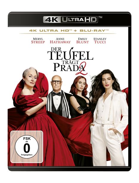 „Der Teufel trägt Prada 2“. Vier elegant gekleidete Personen, zwei in Rot und eine in Weiß.