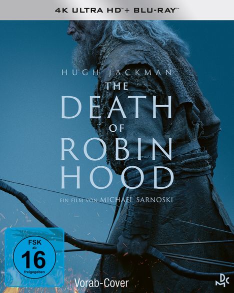 Text: "HE WAS NO HERO", "HUGH JACKMAN", "THE DEATH OF ROBIN HOOD", "AB 18. JUNI IM KINO". Ein älterer Mann mit Bogen und Pfeilen.