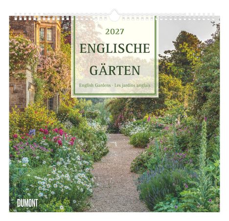 2027 ENGLISCHE GÄRTEN. Ein blühender Garten mit Kiesweg, umgeben von bunten Blüten und alten Gebäuden.