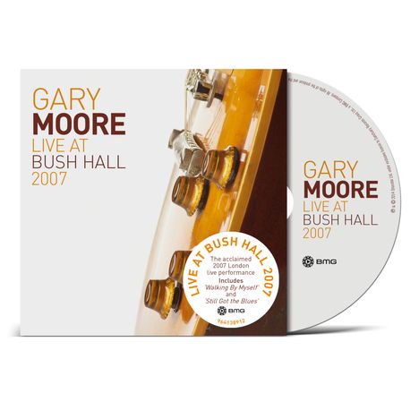 "GARY MOORE LIVE AT BUSH HALL 2007." Nahaufnahme einer Gitarre und eine CD mit wiederholtem Text, BMG-Logo.