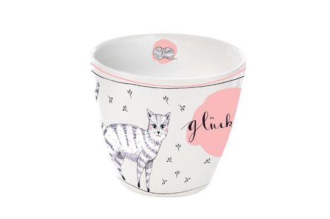 Der Text "glück" steht auf einem rosa Fleck. Eine gezeichnete Katze und ein Wollknäuel zieren den Hintergrund.