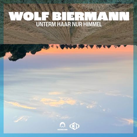 „WOLF BIERMANN UNTERM HAAR NUR HIMMEL“ steht in großen weißen Buchstaben. Darunter ein Naturbild teils kopfüber.