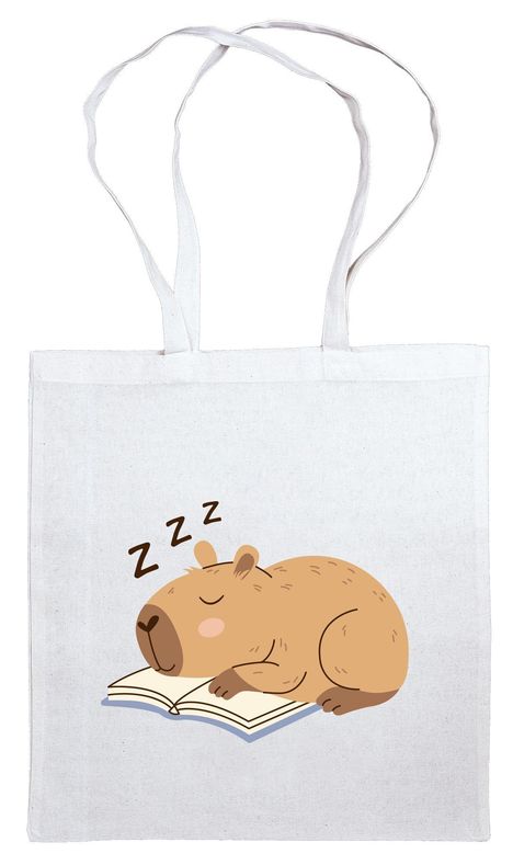 "Zzz" über einem schlafenden Capybara, das auf einem Buch ruht. Illustrationsstil auf einer weißen Tragetasche.