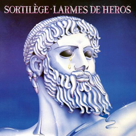 "Sortilège Larmes de Héros" steht oben. Eine Statue eines bärtigen Mannes mit einer Träne aus Gold.