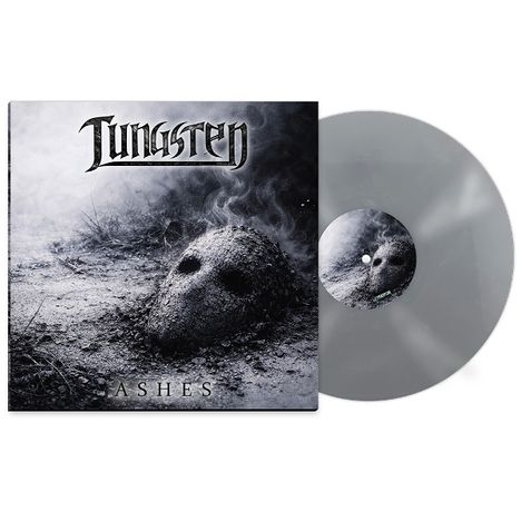 "Aus 'Tungsten Ashes'. Albumcover zeigt eine Maske im Aschehaufen, daneben graue Schallplatte."