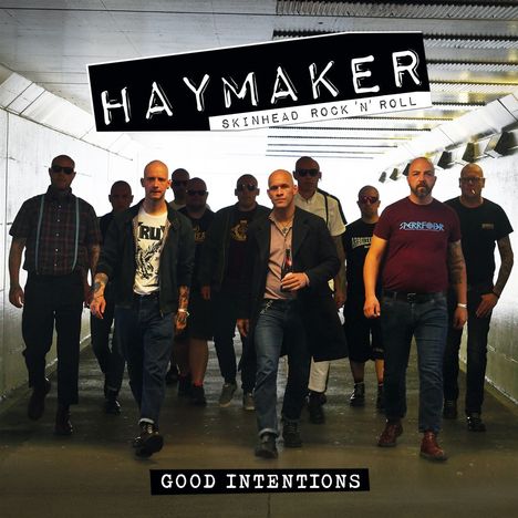 "Haymaker: Skinhead Rock 'n' Roll. Good Intentions." Eine Gruppe von Männern in dunkler Kleidung in einem Tunnel.