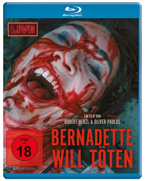 FSK ab 18. LIVE. Bernadette will töten. Ein Film von Robert Herzl & Oliver Paulus. Blutverschmiertes Gesicht lacht.