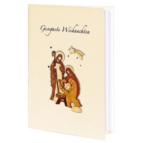 "Gesegnete Weihnachten" in eleganter Schrift. Illustration der Krippenszene mit Stern und Figuren aus Holz.
