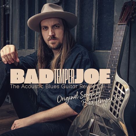 Texte: "BAD TEMPER JOE", "The Acoustic Blues Guitar Revue Vol. 1", "Original Songs of Bad Temper Joe".  
Ein Mann mit Gitarre und Hut.
