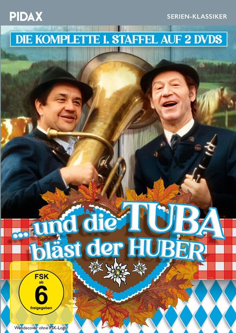 "Die komplette 1. Staffel auf 2 DVDs. ...und die Tuba bläst der Huber. Zwei Männer in Tracht halten Tuba und Klarinette."