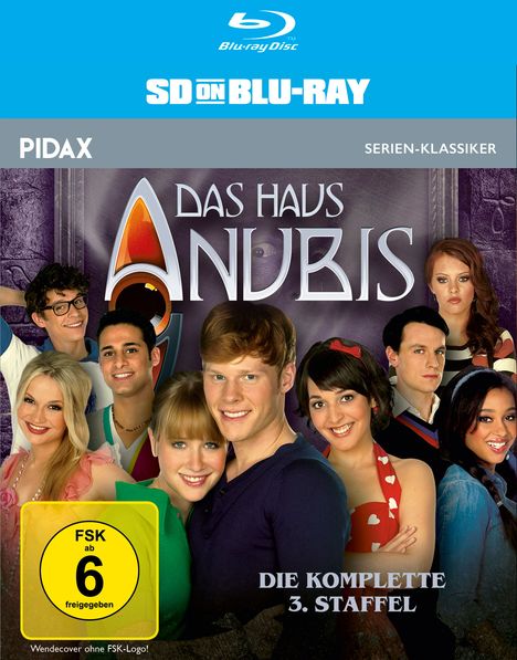 Beschreibung einer Blu-ray-Hülle. Oben steht "SD ON BLU-RAY". Titel: "DAS HAUS ANUBIS". Darunter fröhliche Personen. FSK 6.