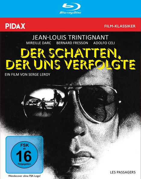 Text: "Der Schatten, der uns verfolgte", "Jean-Louis Trintignant", "FSK ab 16". Illustration eines Mannes mit Sonnenbrille.