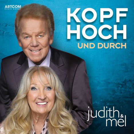 "Artcom Music Group", "Kopf Hoch und Durch", "Judith & Mel". Ein lächelndes Paar vor blauem Hintergrund.