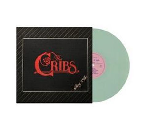 „The Cribs“ in roter Schrift auf einem schwarzen Albumcover. Unten rechts „Swing II/16“. Links daneben eine grüne Schallplatte.
