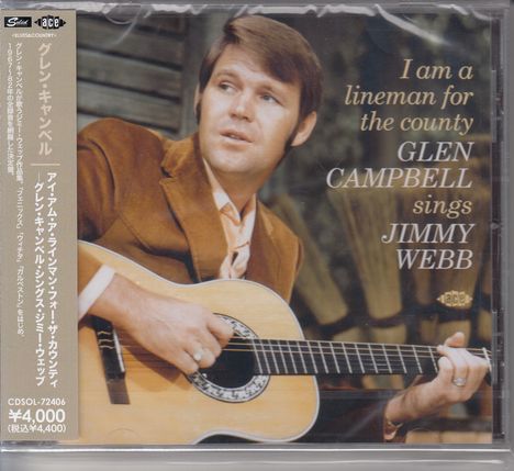 Text: "I am a lineman for the county, GLEN CAMPBELL sings JIMMY WEBB". Ein Mann spielt Gitarre, trägt braunen Anzug.