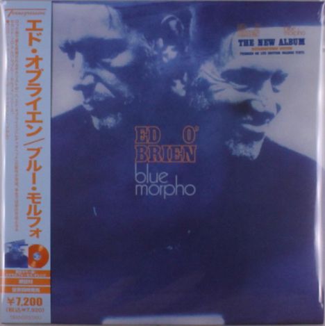 Text: "ED O'BRIEN blue morpho". Links sind japanische Schriftzeichen auf einem Streifen. Zwei Gesichter in blauem Ton.