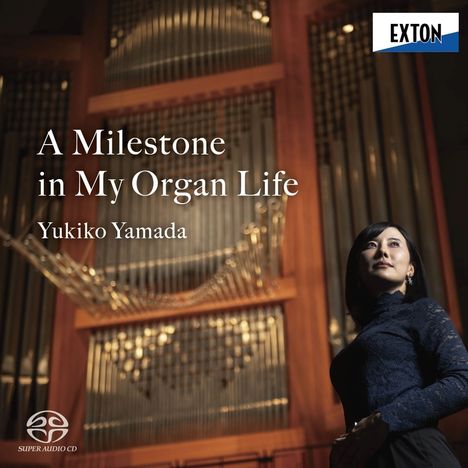 "A Milestone in My Organ Life" Yukiko Yamada. Logo oben rechts. Frau vor einer großen Orgel.