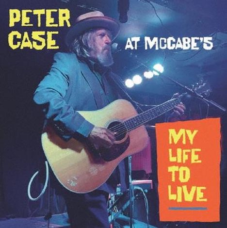 Text: "PETER CASE AT MCCABE'S" und "MY LIFE TO LIVE". Ein Mann spielt Gitarre auf einer Bühne mit Mikrofon.