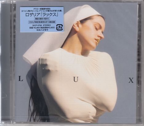 Blauer Aufkleber mit japanischem Text. Darunter steht groß "LUX". Frau im Profil mit geschlossenen Augen, in weiß gekleidet.