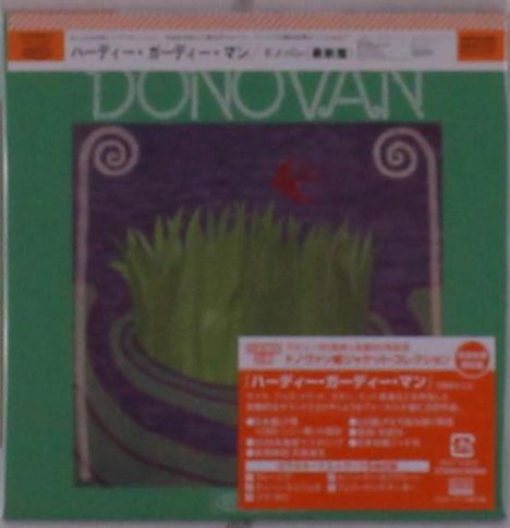 Texte umfassen: "DONOVAN" in großen Buchstaben, japanische Schriftzeichen. Grüne Fläche mit Grashalm-Illustration.