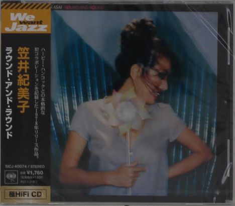 "Wir wollen Jazz" und japanischer Text auf Cover. Frau lächelt mit Windrad vor blauem Hintergrund.