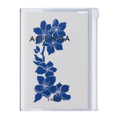 Text: "AGENDA 2027". Blaue Blumenillustration auf hellen Hintergrund.