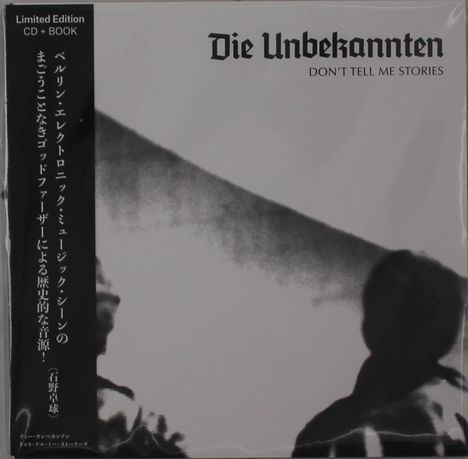 Limited Edition CD + Book. Die Unbekannten: Don't Tell Me Stories. Schwarz-weiß mit Silhouetten.
