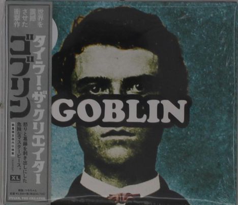 Texte: "GOBLIN", japanische Schriftzeichen. Illustration eines Mannes mit energischem Gesichtsausdruck vor blauem Hintergrund.