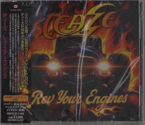"Rev Your Engines" steht vor einem flammenden Auto. Japanische Schrift und fetziges Schriftzug-Logo oben.