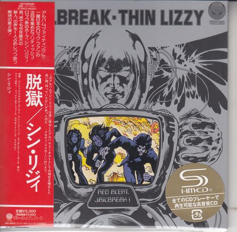 Texte: "RED ALERT. JAILBREAK!" Oben schwarzer Schriftzug "JAILBREAK.THIN LIZZY". Illustration: Roboter, Explosion, fliehende Figuren.