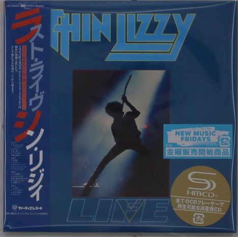 "THIN LIZZY" in großen Buchstaben oben, daneben japanische Schriftzeichen. Silhouette eines Gitarristen im Spotlight.