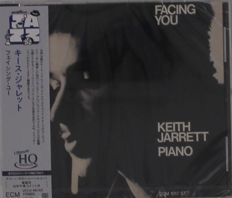 Aufschrift: "FACING YOU", "KEITH JARRETT", "PIANO". Links ist ein japanischer Textstreifen. Das Bild zeigt ein Gesicht im Schatten.