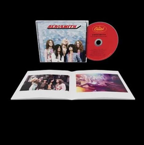Text "Aerosmith" auf CD und Cover. Zeigt Bandmitglieder, darunter ein offenes Booklet mit Fotos.